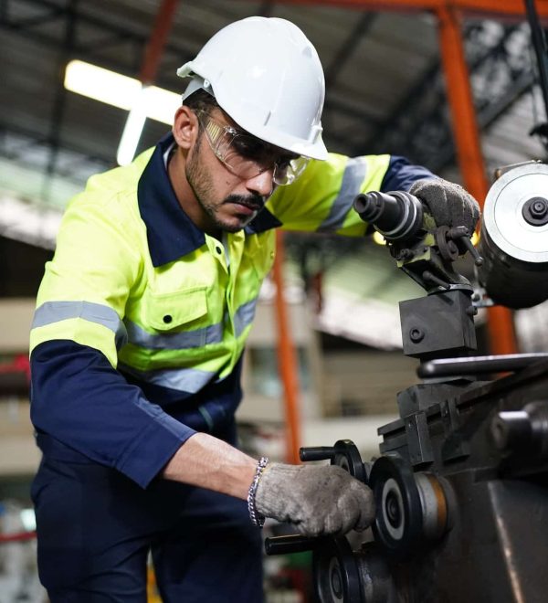 industrial factory worker working in metal manufacturing industry